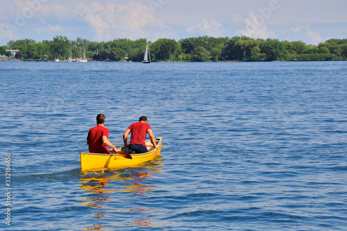 Paddling canoe in Lake Ontario with Center Island as background