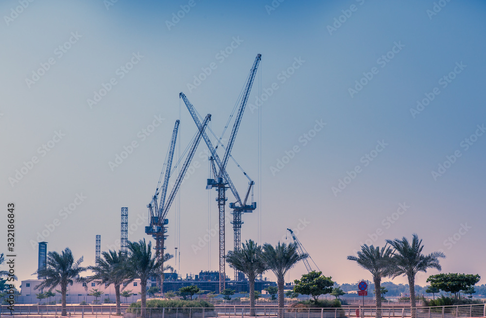 Construction site area. Heavy duty cranes for industrial, commercial and buildings construction. Construction site area. Heavy duty cranes for industrial, commercial and buildings construction.