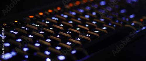 Computer gaming keyboard,Closeup of laptop keyboard illumination, backlit keyboard.
