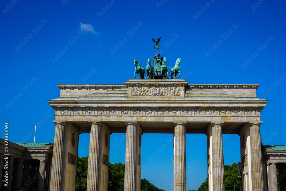 The majestic Brandenburg Gate against the blue sky.