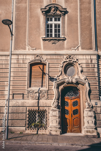 old very dilapidated doorin a white building photo