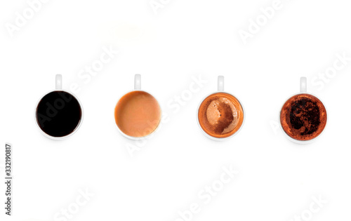 four cups of different coffees, alone, with milk, cappuccino, macchiato