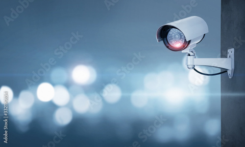 Close up of CCTV camera over defocused background with copy space photo