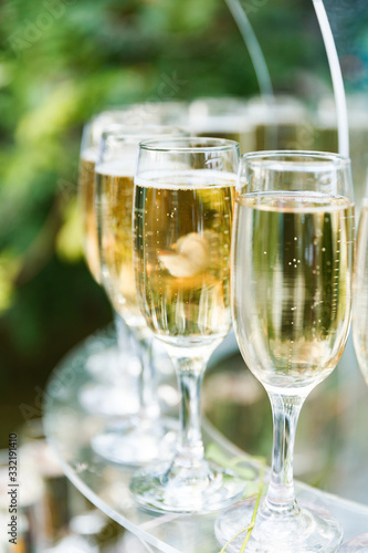 Glasses of champagne and sparkling wine served at charity event, alcoholic drinks close-up