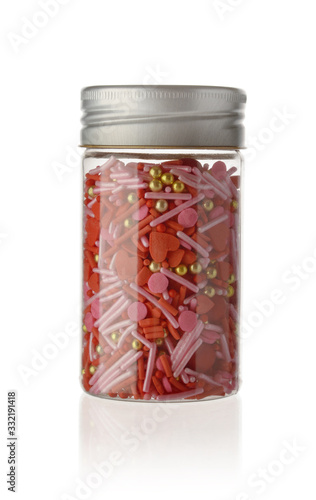 Full color topping sprinkle in glass bottle on isolated