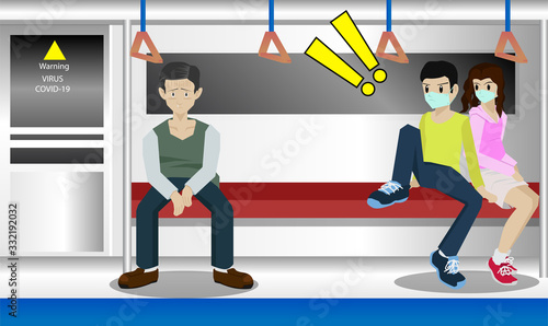 The person infected with the virus Covid-19 has a runny nose sitting on the train no protection. Two passengers wearing a mask were seen to distance themselves to maintain distance for safety.