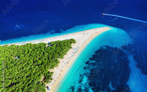 Croatia, Hvar island, Bol. Panoramic aerial view at the Zlatni Rat. Beach and sea from air. Famous place in Croatia. Summer seascape from drone. Travel - image © biletskiyevgeniy.com