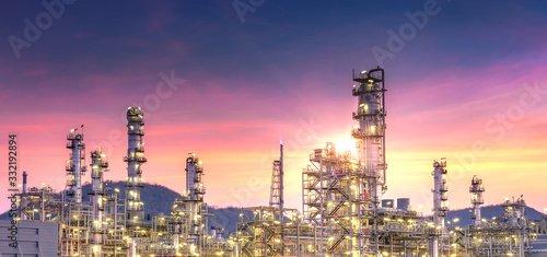 Panorama view of petrochemical oil and gas refinery and pipeline industry with sunset sky background