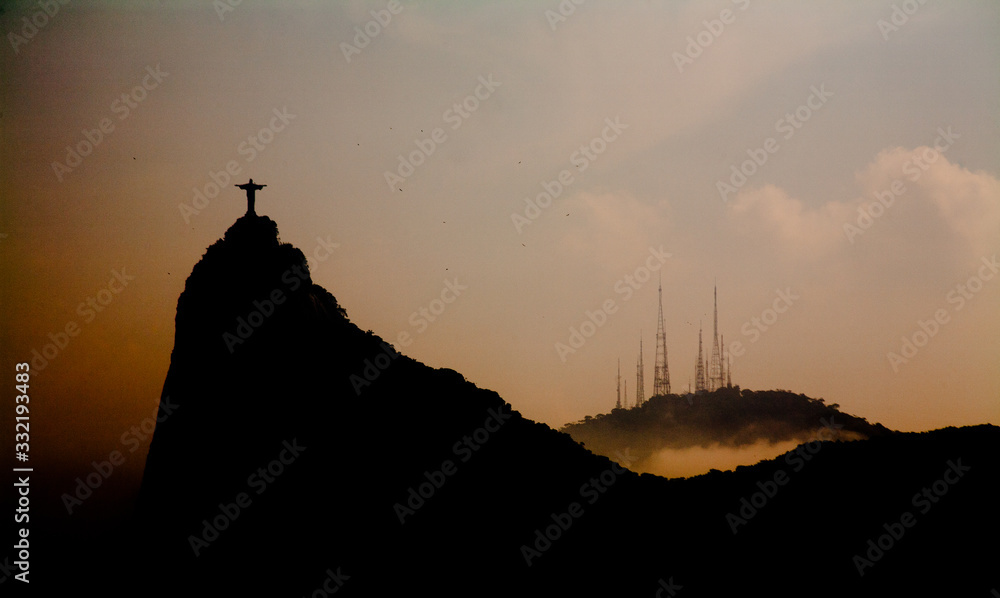Corcovado and communication antennas at sunset in the city of Rio de Janeiro