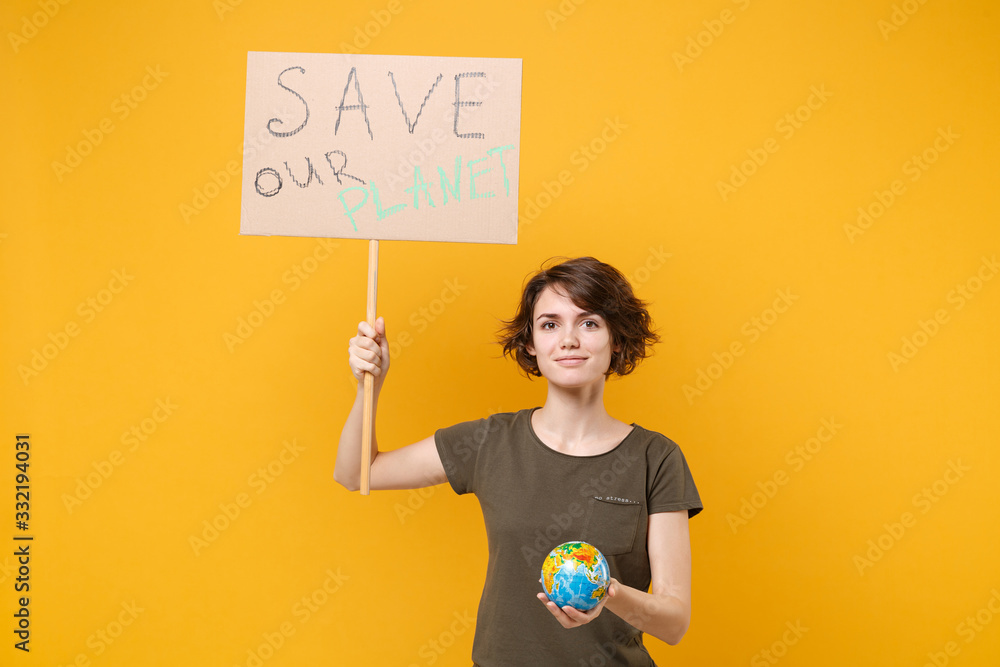 Smiling young protesting woman hold protest sign broadsheet placard on stick Earth world globe isolated on yellow background. Stop nature garbage ecology environment protection concept. Save planet. Smiling young protesting woman hold protest sign broadsheet placard on stick Earth world globe isolated on yellow background. Stop nature garbage ecology environment protection concept. Save planet.