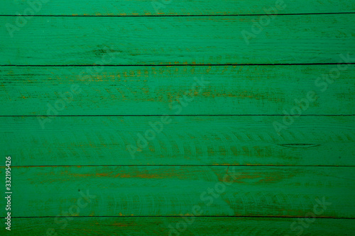Vintage green wood background texture with knots and nail holes. Old painted wood wall. Brown abstract background. Vintage green wooden dark horizontal boards. Front view with copy space. Background f
