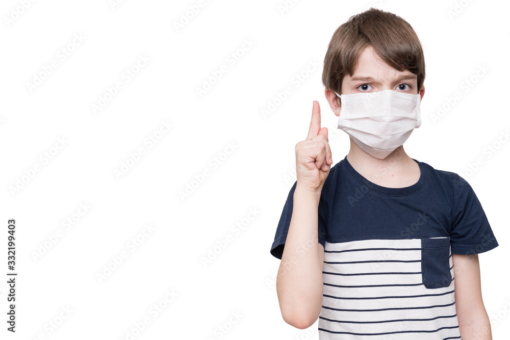 Portrait of kid with face mask pointing finger up, isolated on white background Portrait of kid with face mask pointing finger up, isolated on white background