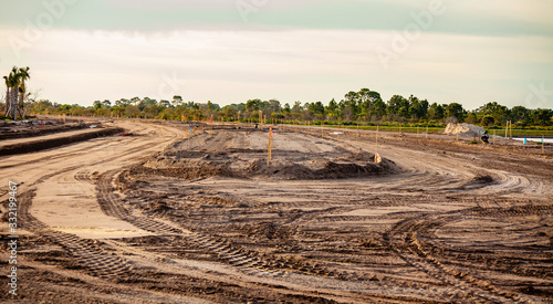 A new road is under construction with several pieces of heavy equipment