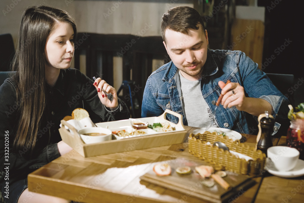 Fototapeta premium Man and a woman in a restaurant.