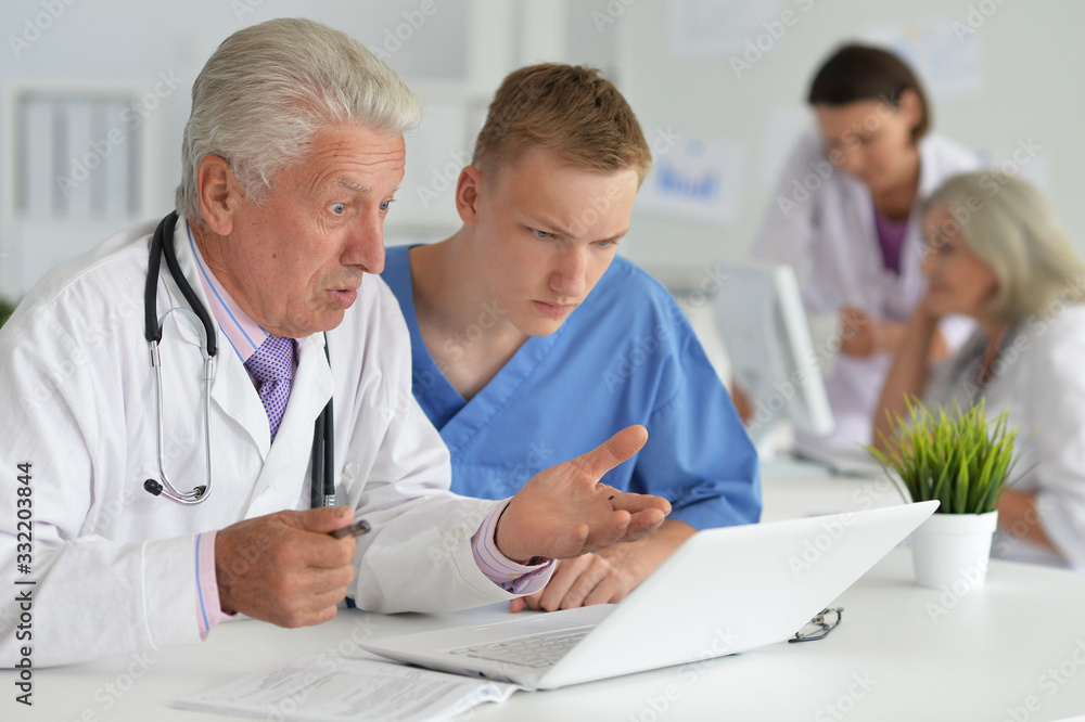 Portrait of professional doctors working in cabinet Portrait of professional doctors working in cabinet