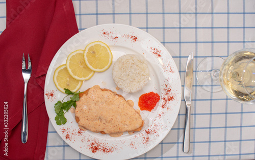 Cooked Rib-eye meal rice, steak and lemon. Glass with wine. Flat tlay photo