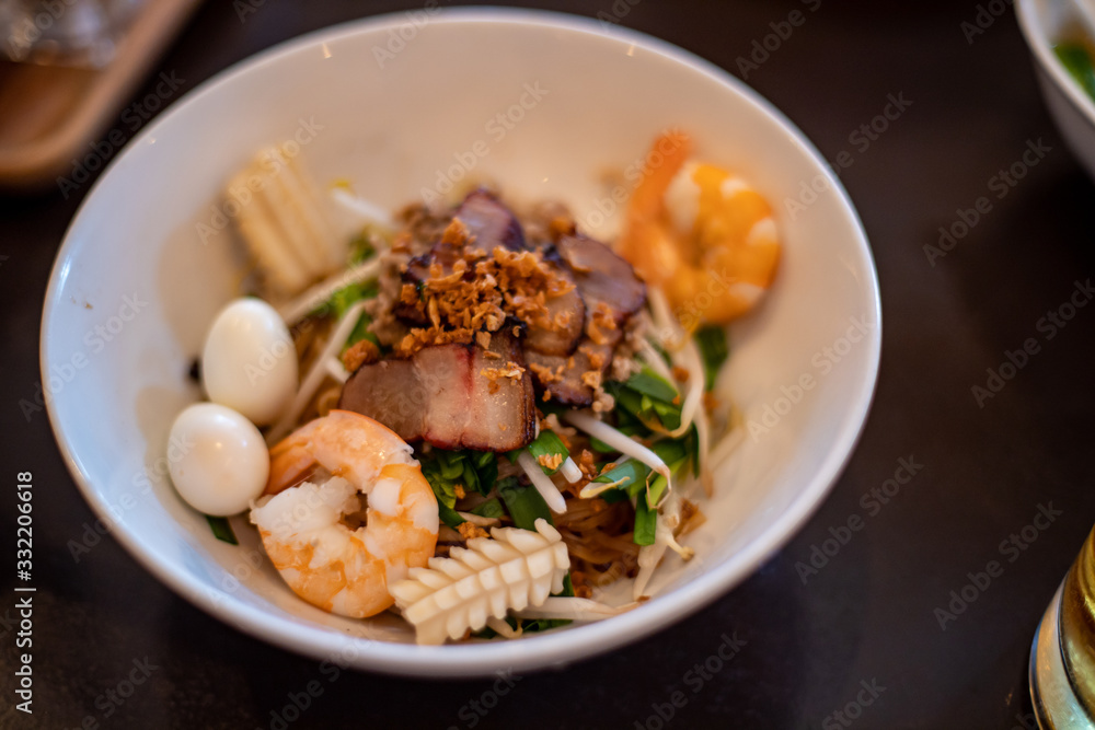 Vietnamese food dish with noodle, shrimp, quail egg, pork and vegetables Vietnamese food dish with noodle, shrimp, quail egg, pork and vegetables