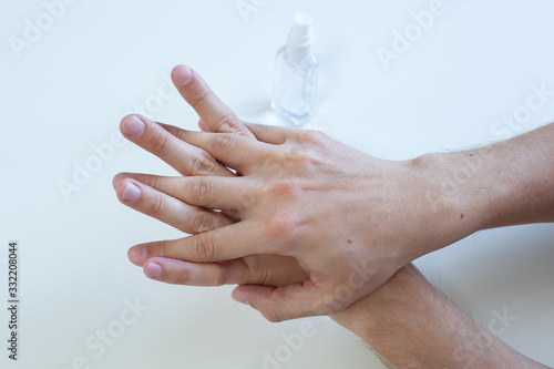 Man hand using wash hand sanitizer gel pump dispenser for protection coronavirus, germ and bacteria, health care concept, 8 step hand wash prevention covid19. Closeup hand applies a disinfectant spray