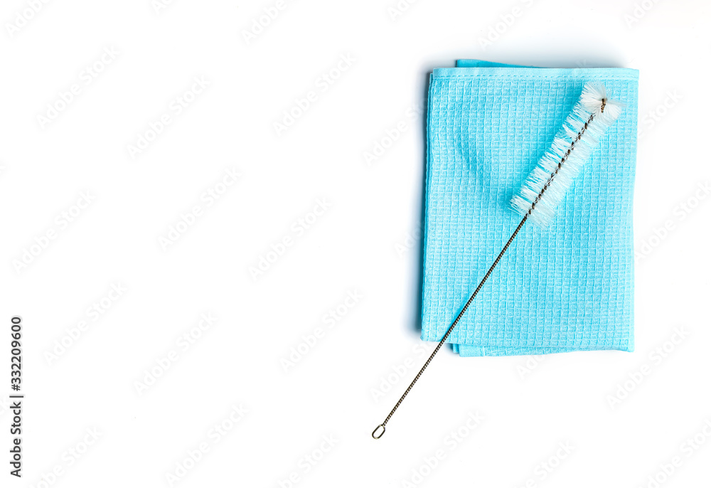 blue cleaning cloth and brush on white background blue cleaning cloth and brush on white background
