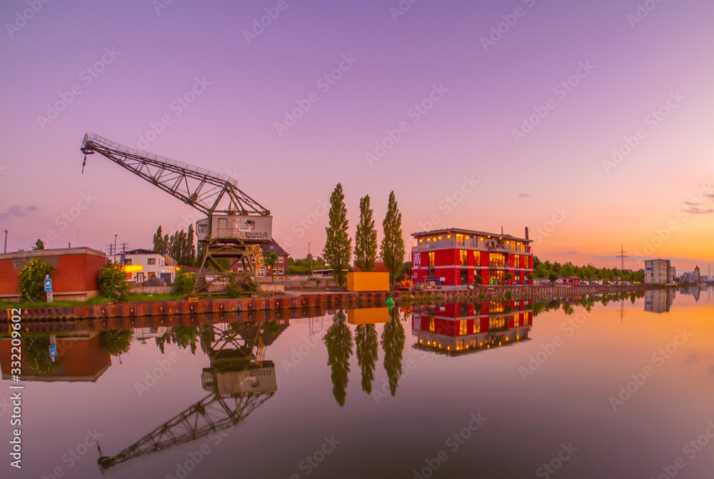Crane in the port of Hamm Westfalen in the Ruhrgebiet at sunset