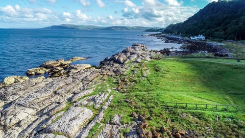 Atlantic coast, Northern Ireland. Garron Point. Geological formation, parking and marina at Antrim Coast Road, a.k.a. Causeway Coastal Route. One of the most scenic coastal roads in Europe. Aerial