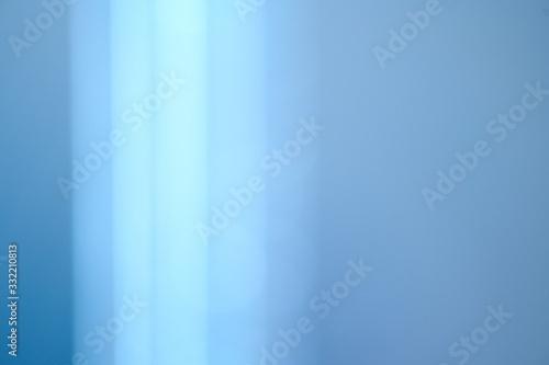Abstract Lens Flare backdrop, Technology background, prism Bokeh Lights. Photo of Leaking Reflection of a Glass, Crystal, Defocused Shining Colorful Light Leaks, Rays blue Background. 