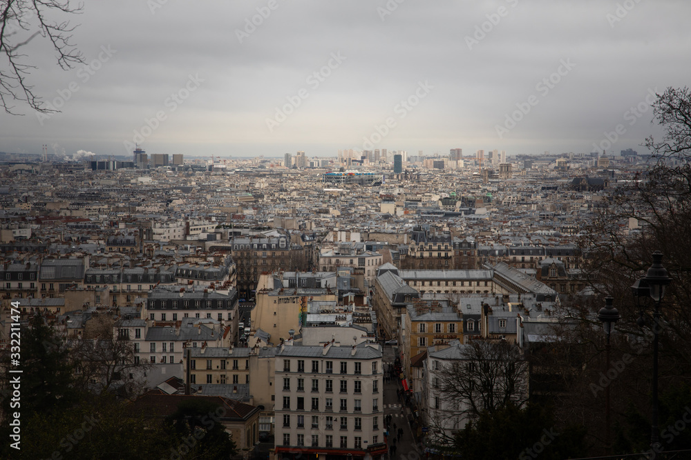 High view of Paris from Montmartre hill next to the Sacre-Coeur basilica, France.
