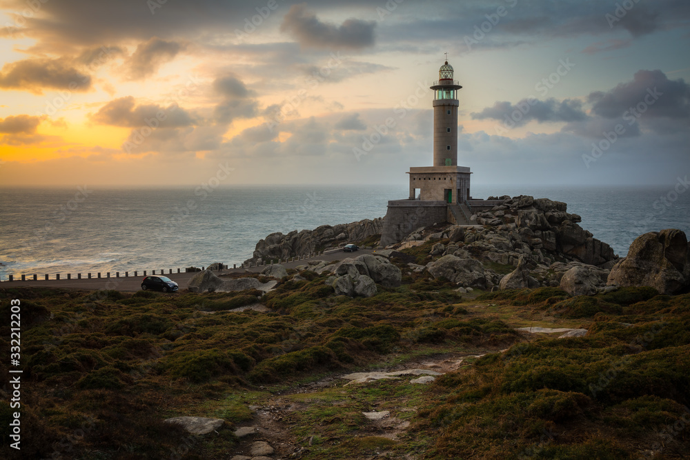 punta nariga lighthouse at sunset in spain 