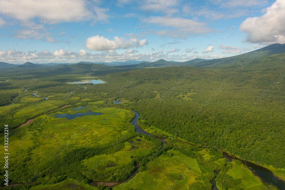 Obraz premium aerial view of Kamchatka volcanos, green valleys, snow and ice and the wonderful view of pure nature.