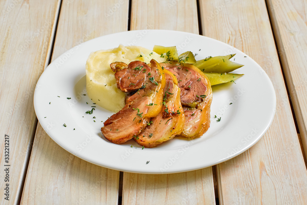 Baked bacon with mashed potato and pickle cucumber Baked bacon with mashed potato and pickle cucumber
