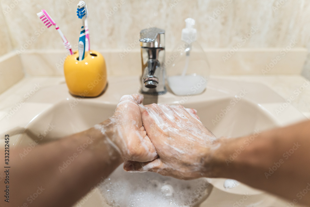 Fototapeta premium Point of View of Person Washing Hands with Soup at Home.