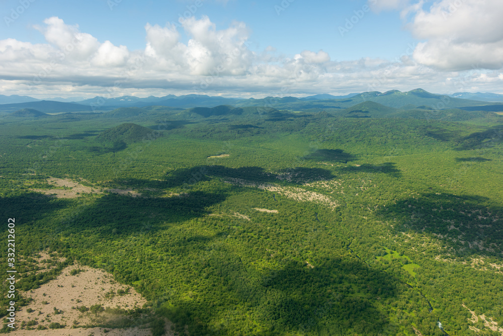 Naklejka premium aerial view of Kamchatka volcanos, green valleys, snow and ice and the wonderful view of pure nature.