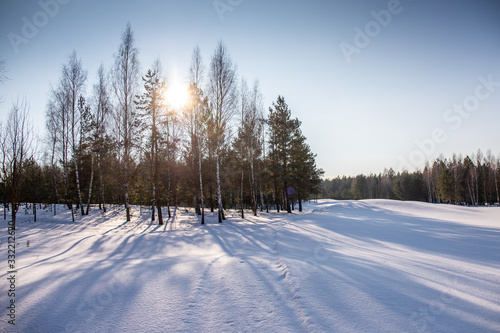 great sunny day on snowy golf field