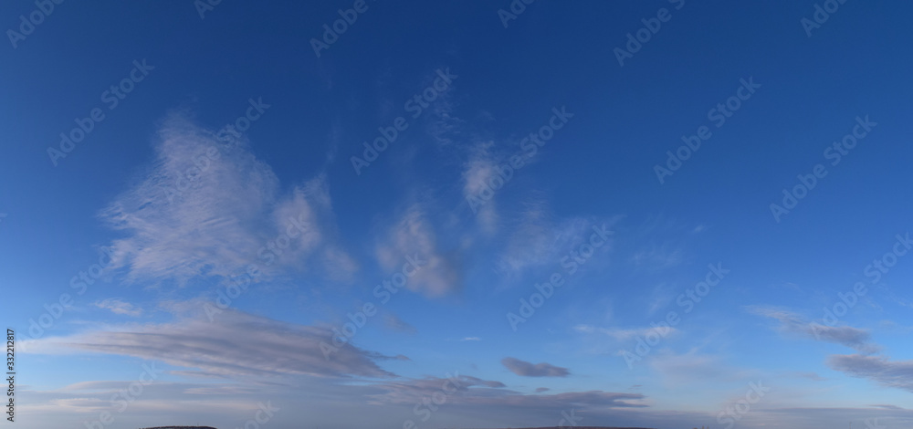 Fototapeta premium Spring. Daytime Panoramic photo of the cloudy sky, March, fresh air.