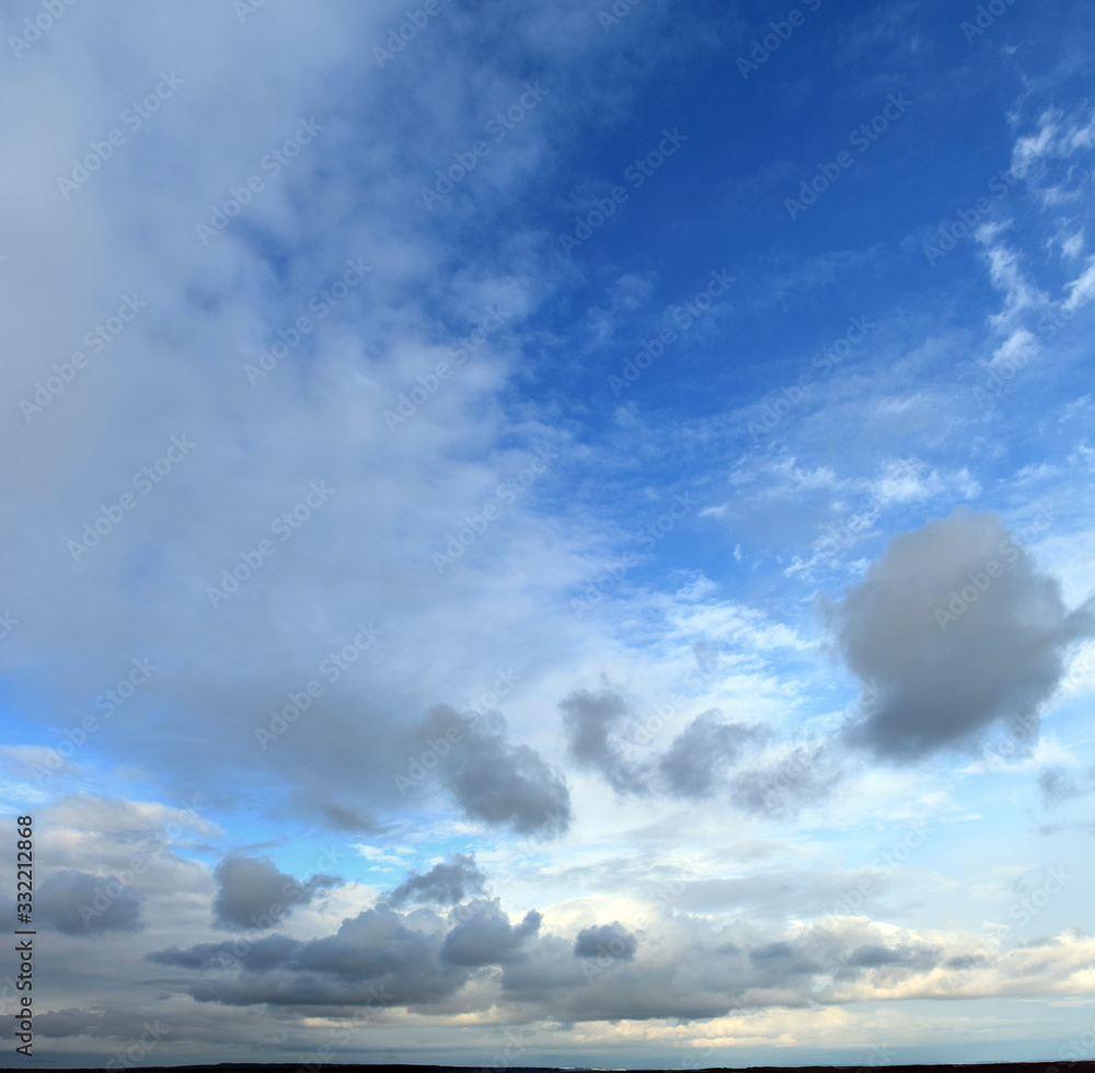 Obraz premium Spring. Daytime Panoramic photo of the cloudy sky, March, fresh air.