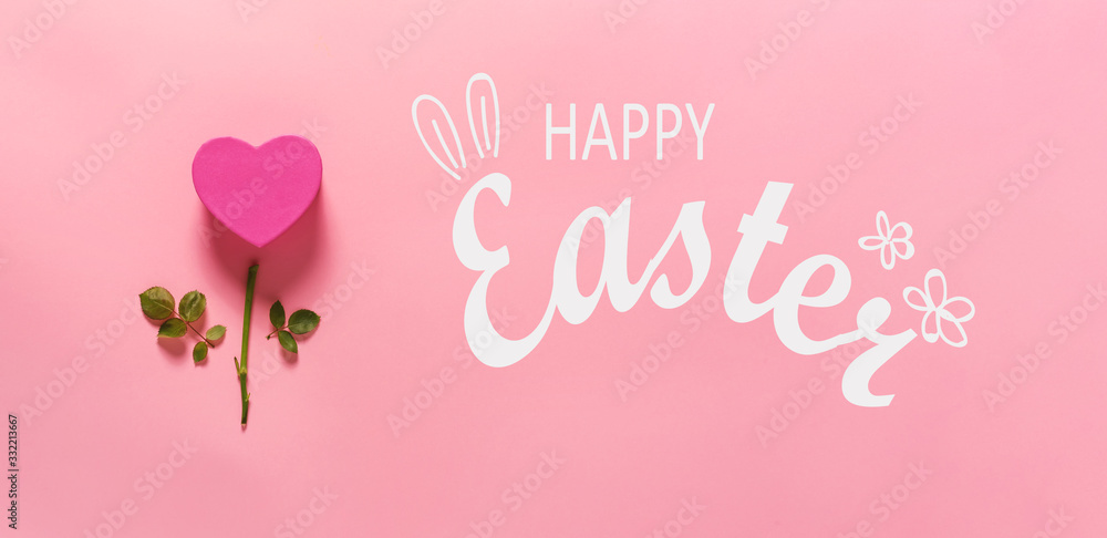 Happy Easter message with heart flower top view flat lay