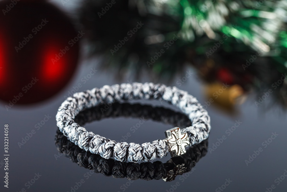 Braided bracelet made of synthetic thread. Decoration and amulet Braided bracelet made of synthetic thread. Decoration and amulet