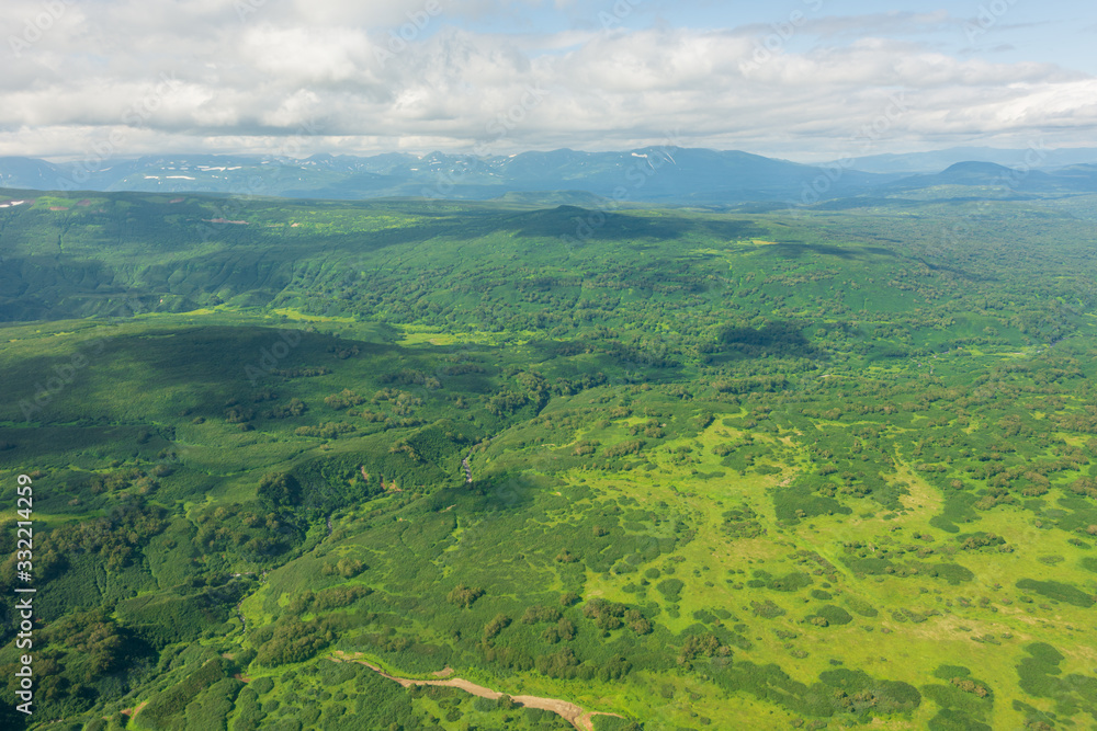 Obraz premium aerial view of Kamchatka volcanos, green valleys, snow and ice and the wonderful view of pure nature.