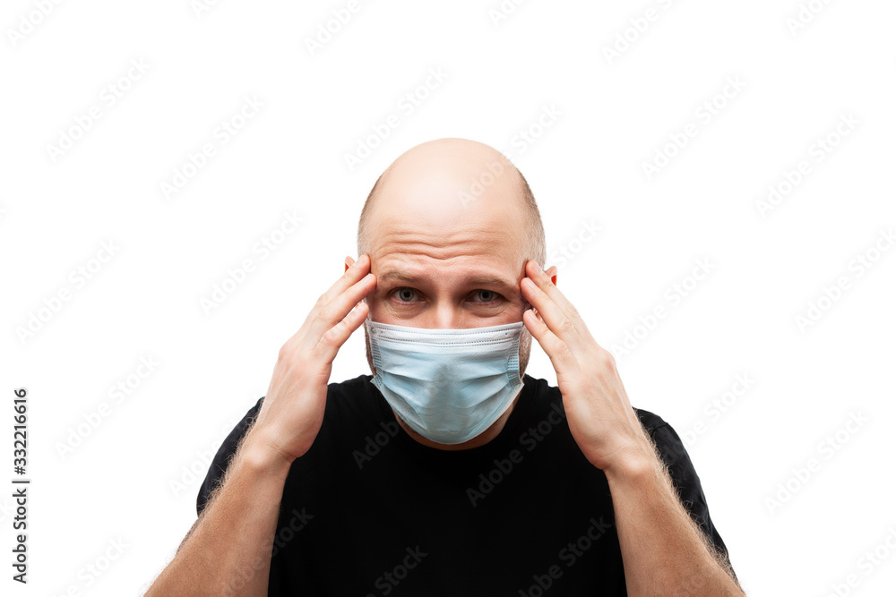 Young adult bald head man wearing respiratory protective medical mask Young adult bald head man wearing respiratory protective medical mask