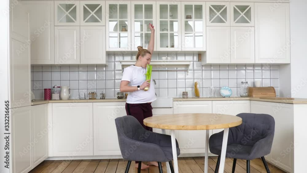 Cute and Fun Pregnant Mother Active Dancing in Home. Happy Emotions Young Mum. Happy pregnancy Cute and Fun Pregnant Mother Active Dancing in Home. Happy Emotions Young Mum. Happy pregnancy