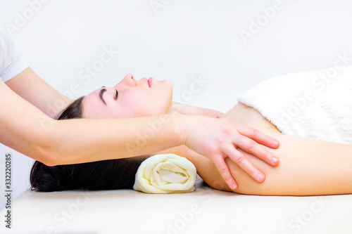 massage in a spa salon for a girl. Wellness massage concept. light background