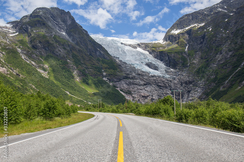 empty roads that run through spectacular landscapes, roads near the northern fjords, incredible mountains, snowy peaks, abundant vegetation