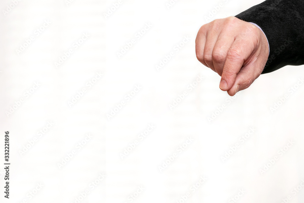 Obraz premium Hand of man holding something with two fingers, blank for design, copy space_