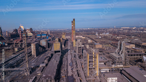 Steel ecology metallurgical iron plant smokes from pollution of industry pipes. View from the drone. © Андрей Трубицын
