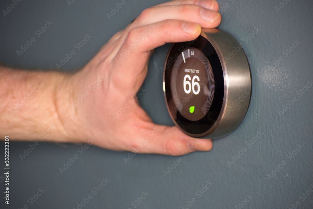 Fototapeta premium Green tech- Electric thermostat to save money and energy