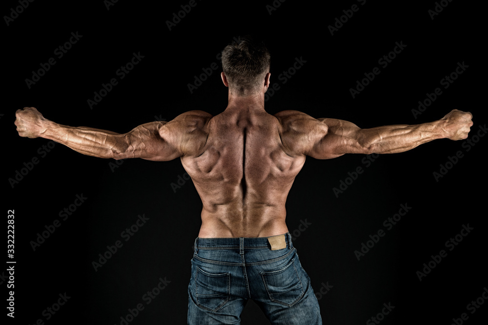 Train harder. Sportsman show muscular back. Bodybuilder black background. Athletic training. Muscle training. Physical training activity and sports. Fitness training. Weightlifting and bodybuilding Train harder. Sportsman show muscular back. Bodybuilder black background. Athletic training. Muscle training. Physical training activity and sports. Fitness training. Weightlifting and bodybuilding
