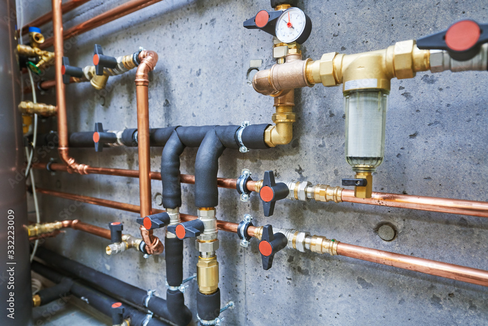 Plumbing service. copper pipeline of a heating system in boiler room Plumbing service. copper pipeline of a heating system in boiler room