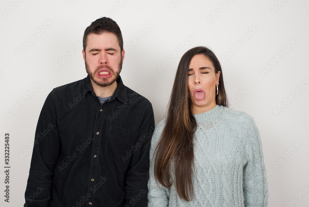 Negative human expressions and attitude. Angry dissatisfied female has disgusting expression as sees something not appealing, frowns face, isolated over white background. Distaste and dislike Negative human expressions and attitude. Angry dissatisfied female has disgusting expression as sees something not appealing, frowns face, isolated over white background. Distaste and dislike