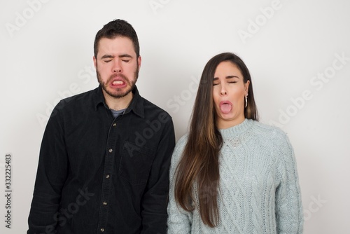 Negative human expressions and attitude. Angry dissatisfied female has disgusting expression as sees something not appealing, frowns face, isolated over white background. Distaste and dislike