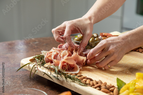 Salami, olives and Prosciutto on Gourmet Charcuterie Board Selective Focus with Copy Space